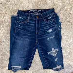 High waisted distressed jeans